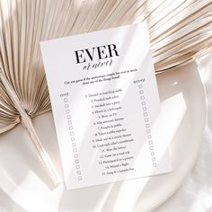 a white plate topped with a checklist next to an open book