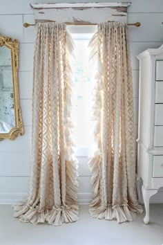 the curtains in this room are made out of ruffled fabric