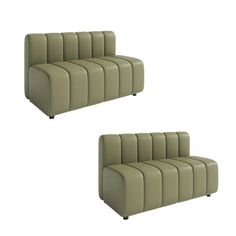 two green leather couches sitting next to each other on top of a white floor