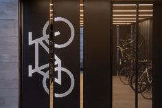 an entrance to a building with bicycles in the background