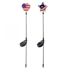 two golf clubs with an american flag on the top and one in the middle, both made out of metal