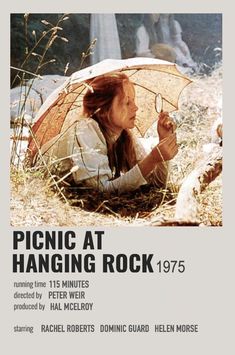 an advertisement for picnic at hanging rock, 1971 with a woman sitting in the grass holding an umbrella