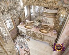 a fancy bathroom with two sinks and mirrors