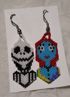 the beaded earrings are designed to look like cartoon characters