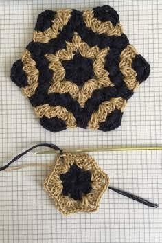 a crocheted square is shown next to a knitting needle