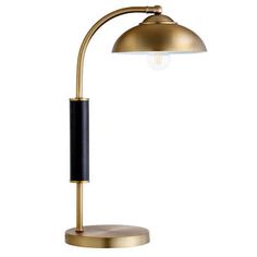 a gold and black lamp on a white background