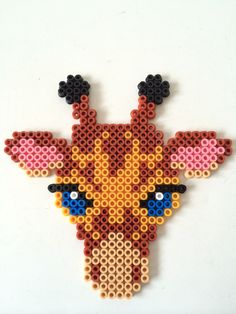 a cross stitch giraffe made out of legos