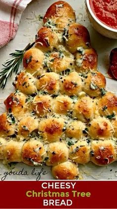 a cheesy christmas tree bread is on a plate