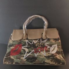 Woman’s Camo Hand Bag By Miss Koo Paris. Handbag Features Camo Design With Drunk Love Bling Design On Front Of Handbag. Sides Expand With Snaps For Extra Room. Zip Closure With 3 Pockets Inside. Also, Includes Zip Pocket On Back Side. Style Number J6618. Super Unique Style. Brand New With Tags. Makes A Great Unique Gift. All Proceeds From This Brand New Hand Bag Go To Horse Sanctuary Charity. Shop Our Cause And Save A Lot Of Money On Great Items! Horse Sanctuary, Camo Handbags, Drunk Love, Paris Green, Bling Design, Drunk In Love, Camo Designs, Charity Shop, Extra Rooms