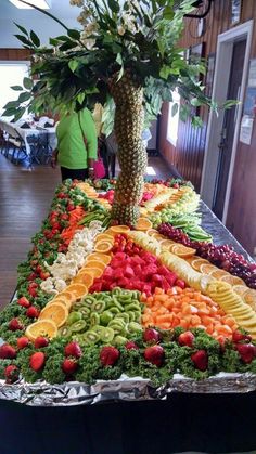 a large display of fruits and vegetables on a table