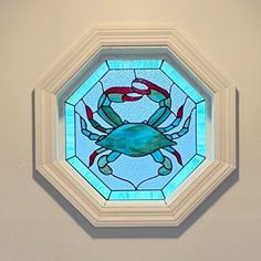 a stained glass window with a crab on it