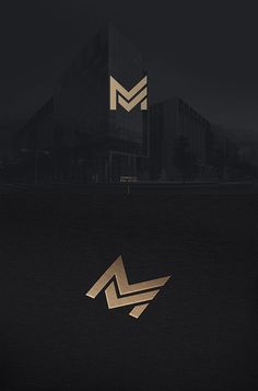 the letter m is made out of gold foil and it looks like an abstract logo