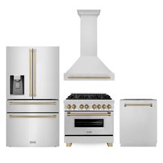 an oven, refrigerator and stove with gold trimmings are shown against a white background