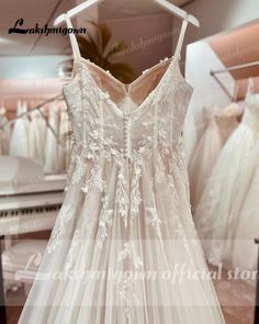 wedding dresses are on display at the bridal shop