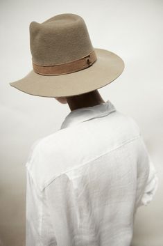 Design Our classic packable hat shape in clay wool with a tonal beige suede band. The flattering and neutral color for all shades of skin and hair. This hat is made from packable wool which means you can easily pack it away in your luggage or bag wherever you may go. This is a staple hat to any wardrobe. Material Our packable wool is sustainable and cruelty-free. We clean, scour and dye our wool in our employee-owned factory right here in the United States. From shearing the wool, to hand polish Classic Brimmed Felt Hat For Everyday, Classic Wide Brim Felt Hat For Everyday, Classic Felt Hat For Everyday Fall Wear, Classic Felt Hat For Fall, Everyday Leather Fedora With Flat Brim, Everyday Solid Felt Hat With Short Brim, Everyday Felt Hat With Short Brim, Elegant Solid Fedora For Everyday Wear, Leather Brimmed Fedora For Everyday Wear