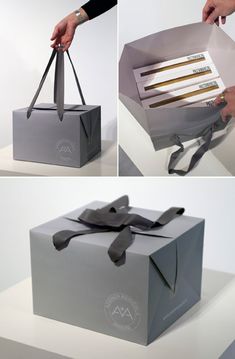 a person holding a black box with two knives in it and the packaging is open