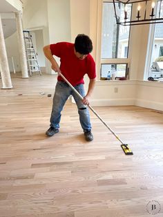 a man with a mop is cleaning the floor