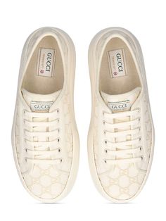 52mm Heel. Off-white canvas with GG embroidered upper. Off-white trim. Front lace-up closure. Logo details. Gucci Tennis 1977 label . All over pattern placement may vary. Rubber platform sole. Includes additional pair of laces Ski Accessories, All Over Pattern, Loafer Mules, Flat Espadrilles, Swim Accessories, Shearling Jacket, Heeled Loafers, White Trim, White Canvas