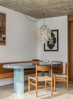 a dining room with a table and chairs