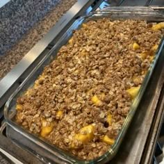 a casserole dish filled with oatmeal sitting on top of an oven