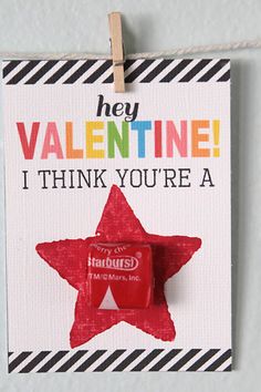 a valentine's day card with a candy bar hanging on a clothes line that says hey valentine it think you're a star