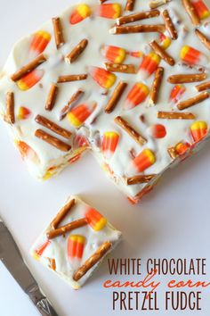 white chocolate candy canes and pretzel fudge on a plate with silverware