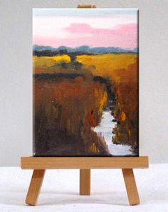 an easel with a painting on top of it