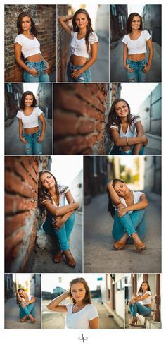 a woman is posing for a photo with her hands on her hips and leaning against a brick wall