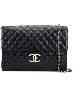 Black lambskin quilted shoulder bag from Chanel Pre-Owned featuring stitching details, a gold-tone logo plaque, a back zip pocket, a chain and leather strap, a foldover top with magnetic closure, an internal zipped pocket and an internal logo stamp. Please note that pre-owned items are not new and therefore might have minor imperfections. Classic Rectangular Shoulder Bag With Diamond Quilting, Designer Rectangular Shoulder Bag With Diamond Quilting, Quilted Shoulder Bag, Shopping Chanel, Stitching Details, Shoulder Bag Black, Logo Stamp, Magnetic Closure, Leather Straps