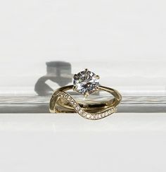 a gold ring with a diamond on top