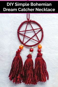 the dream catcher is made with yarn and beads