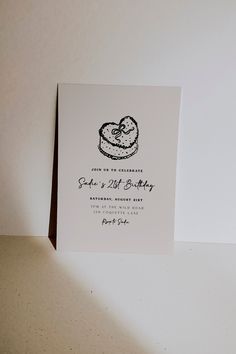 a wedding card with a cake on it