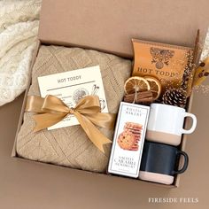 an open box with coffee, cookies and other items