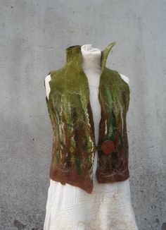 Made to Order Forest woodland merino felted waistcoat MADE TO ORDER Beautiful olive green and chocolate brown, with silk fibers, hand felted onto muslin cotton... Perfect for wrapping up warm and stylishly on these wintery days! It has an elegantly high collar and handmade wooden button. I will, of course, accept orders for a similar color and patterned vest as shown, though it must be remembered that each garment is individually unique and as such, no two are or will ever be, exactly the same. Fitted Green Vest Outerwear, Fitted Green Vest For Fall, Green Winter Vest With Buttons, Sleeveless Buttoned Vest For Costume, Girl Punk, Nuno Felt, Pixies Fairies, Beige Vest, Festival Jacket