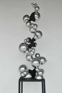 an artistic sculpture made out of metal balls