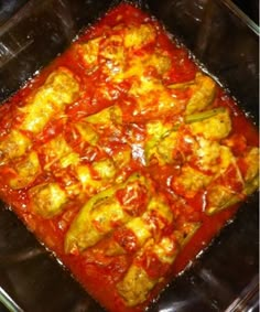 a casserole dish with meat and tomato sauce