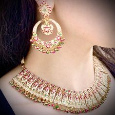 Featuring an elegant and timeless broad necklace with a matching pair of chandbali earrings in 22k gold. The stones used are precious rubies, emeralds and freshwater pearls. Necklace: 54.5 gms including 5.46 gms in the hanging ruby emerald beads Earrings: 24.75 gms including 2.39 gms in the hanging ruby emerald beads Bengali Bridal Jewellery, 22k Gold Jewelry Necklaces, Curl Hair, 22k Gold Jewelry, Chandbali Earrings, Pearl Necklace Set, Emerald Bead, Pearls Necklace, Ruby Emerald