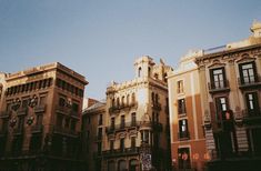 an old european city street with tall buildings