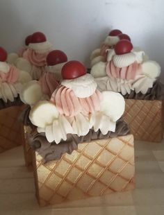 some cupcakes are sitting in ice cream cones