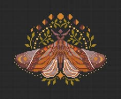 a cross stitched picture of a moth with flowers on it's back ground