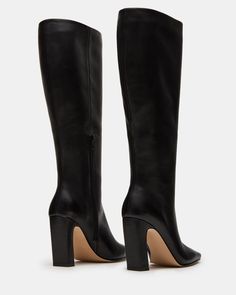 Expertly constructed, the LIZETTE boot is designed with a sleek knee-high silhouette, square toe, and stylish heel. This boot is durable and fashionable, making it the perfect addition to any wardrobe. Elevate your look with these timeless boots. 3.5 inch heel height Size 6 measurements: 16.5 inch shaft circumference, 14.25 inch shaft height Size 8 measurements: 17.25 inch shaft circumference, 14.75 inch shaft height Size 10 measurements: 18 inch shaft circumference, 15.25 inch shaft height Leat Wide Calf Knee High Boots, Timeless Boots, Stylish Heels, Shoe Fits, Wide Calf, 5 Inch Heels, Elevate Your Look, Sweaters Knitwear, Knee High Boots