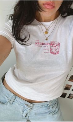 ✨ Negroni Cocktail Social Club Tee ✨ Specifications - 100% ringspun cotton - Light fabric  - Semi-fitted Crafted for those who savor the distinct and robust taste with a combination of bitterness, sweetness, and herbal notes. Wear your love for this iconic cocktail with pride in our uniquely designed tee 🍊🥃  💋 Chic Design: Our tee boasts a chic and trendy design that effortlessly combines aesthetics, specially made for you! 🌸 Comfort is Key: Crafted from ultra-soft, breathable fabric, this t Negroni Cocktail, Retro Cocktail, Shirt Aesthetic, Drinks Design, Club T Shirt, Negroni, Club Shirts, Baby T Shirts, 90s Retro