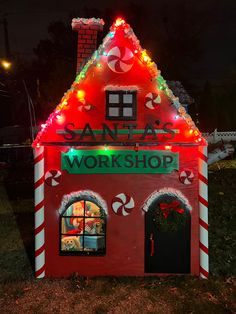 a building with lights and candy canes on it