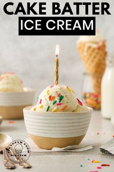 an ice cream sundae with sprinkles and a lit candle in it