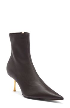 A golden-metal stiletto adds night-out edge to this lambskin-leather bootie that's made in a sock-like silhouette with a pointy toe that helps give legs a long, uninterrupted line. 2 3/4" heel Side zip closure Leather upper and lining/synthetic sole Imported Luxury Pointed Toe Heeled Boots With Leather Sole, Luxury Mid-calf Leather Sole Boots With Pointed Toe, Brown Leather Sole Pointed Toe Booties, Luxury Leather Sole Pointed Toe Booties, Luxury Black Pointed Toe Booties, Toe Socks, Cult Gaia, Fabric Gift Bags, Nordstrom Store