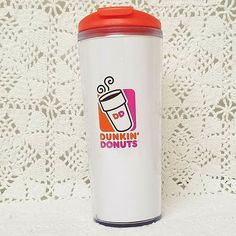 a white and red coffee cup with the words dunkin'donuts on it