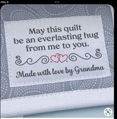 a cross stitch pattern with the words, may this quilt be an everlasing hug from me to you made with love by grandma