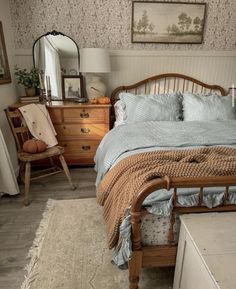 a bed sitting in a bedroom next to a dresser