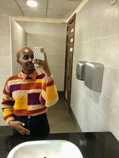 a person taking a selfie in a bathroom