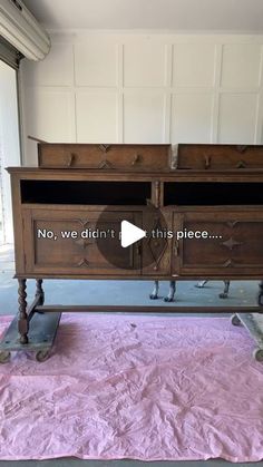 an old dresser is being repaired with pink cloth on the floor and it says, no we didn't this piece